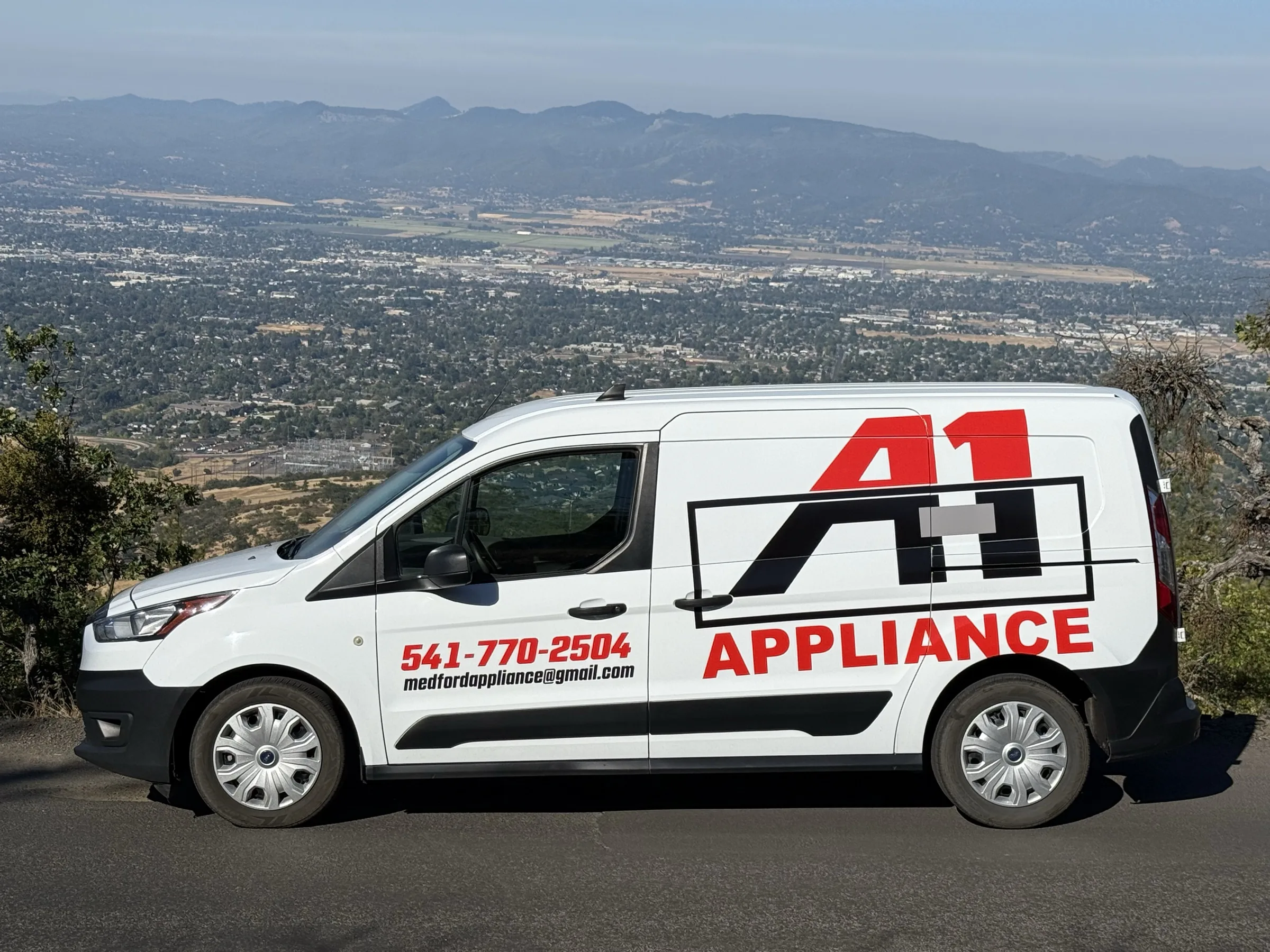 A-1 Appliance service van with a Southern Oregon valley backdrop