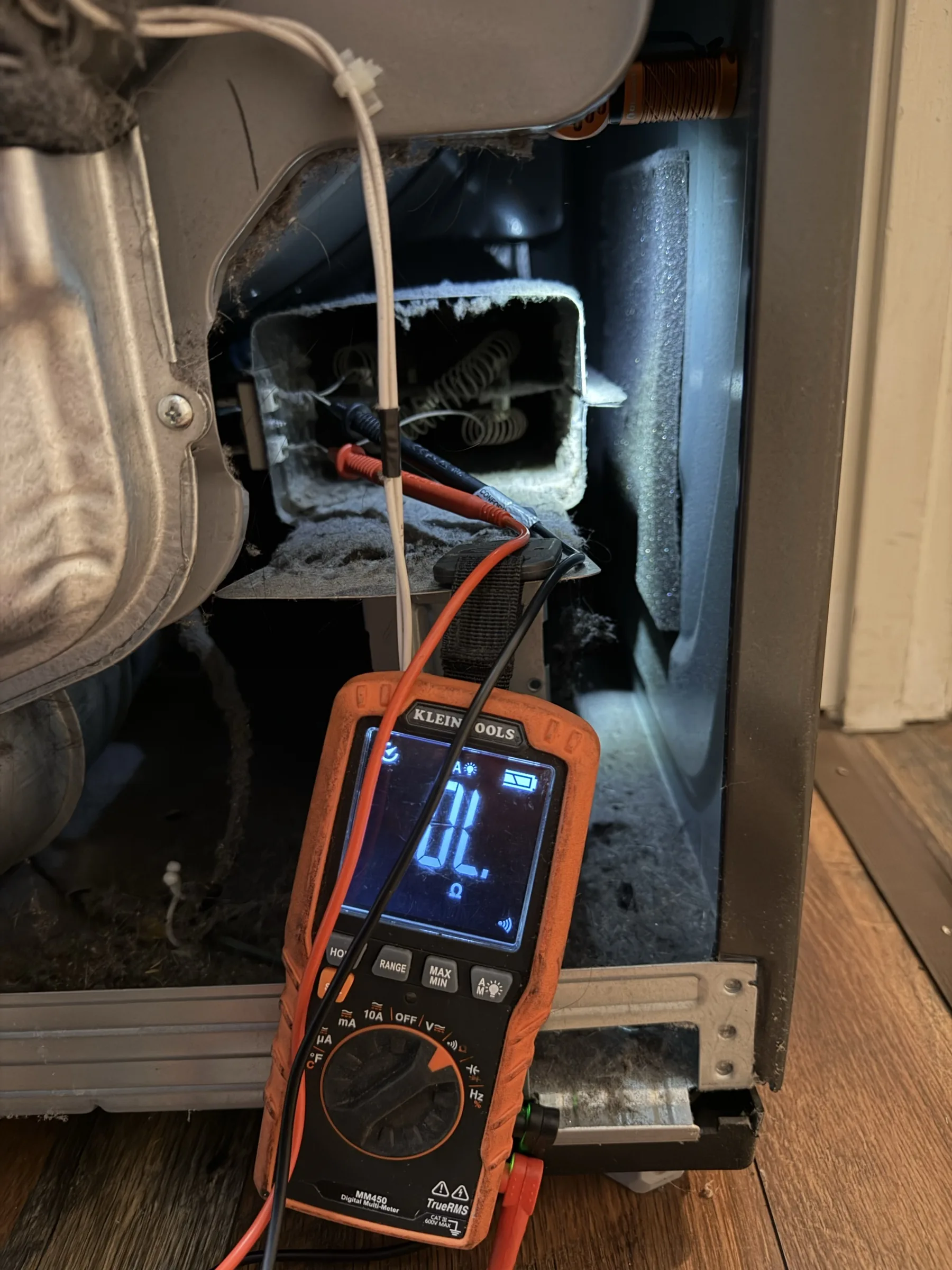 Electrical testing of a dryer heating element with a multimeter