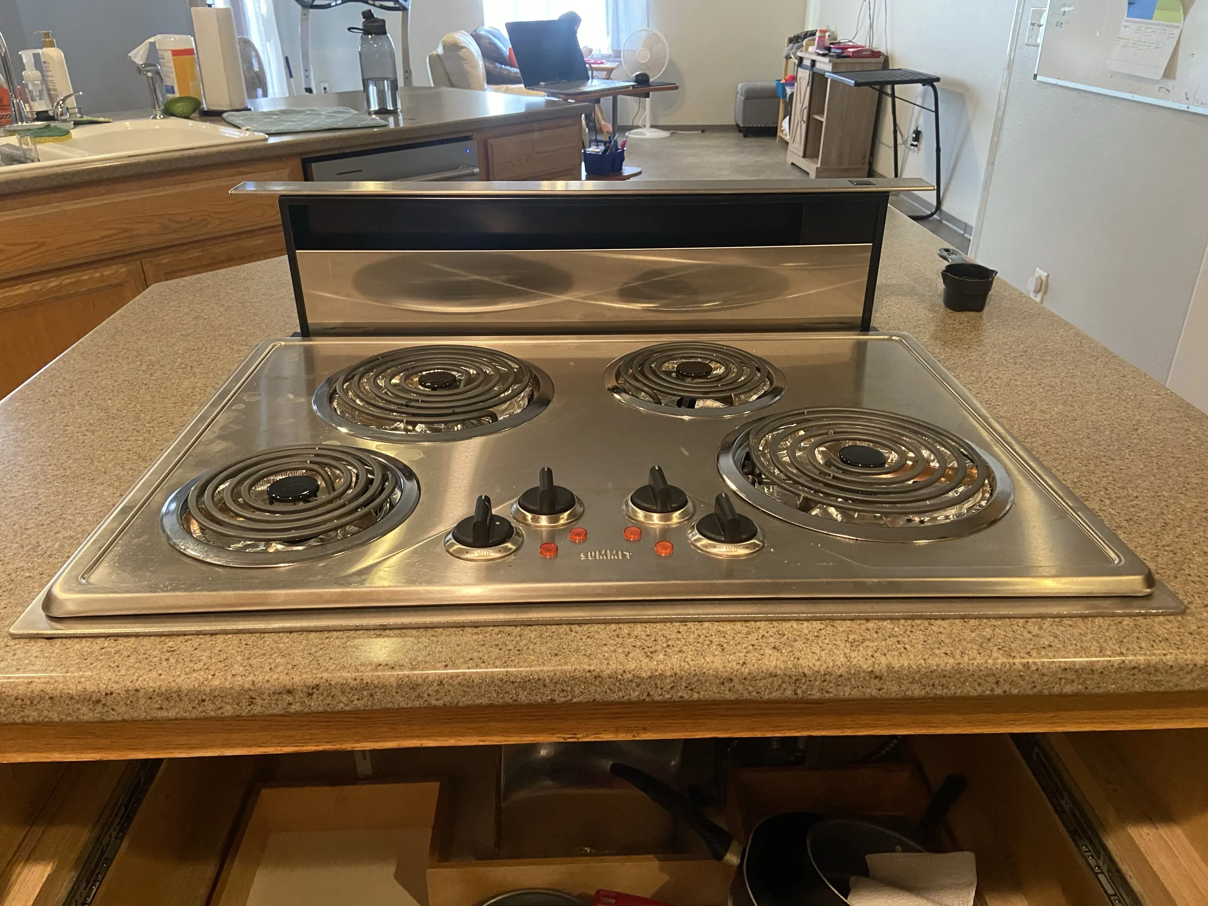 Four-burner electric cooktop in a residential kitchen