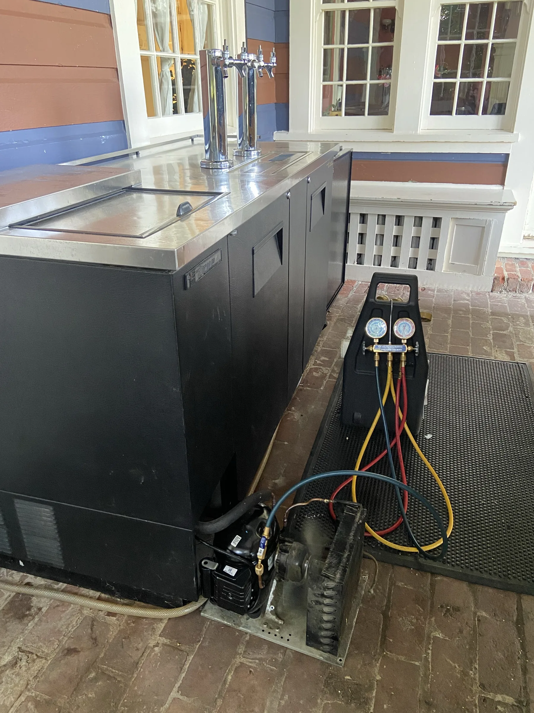 Refrigeration equipment with service gauges and a vacuum pump